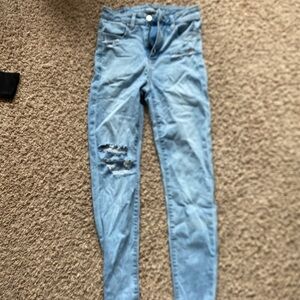 Women's Light Blue Distressed Jeans